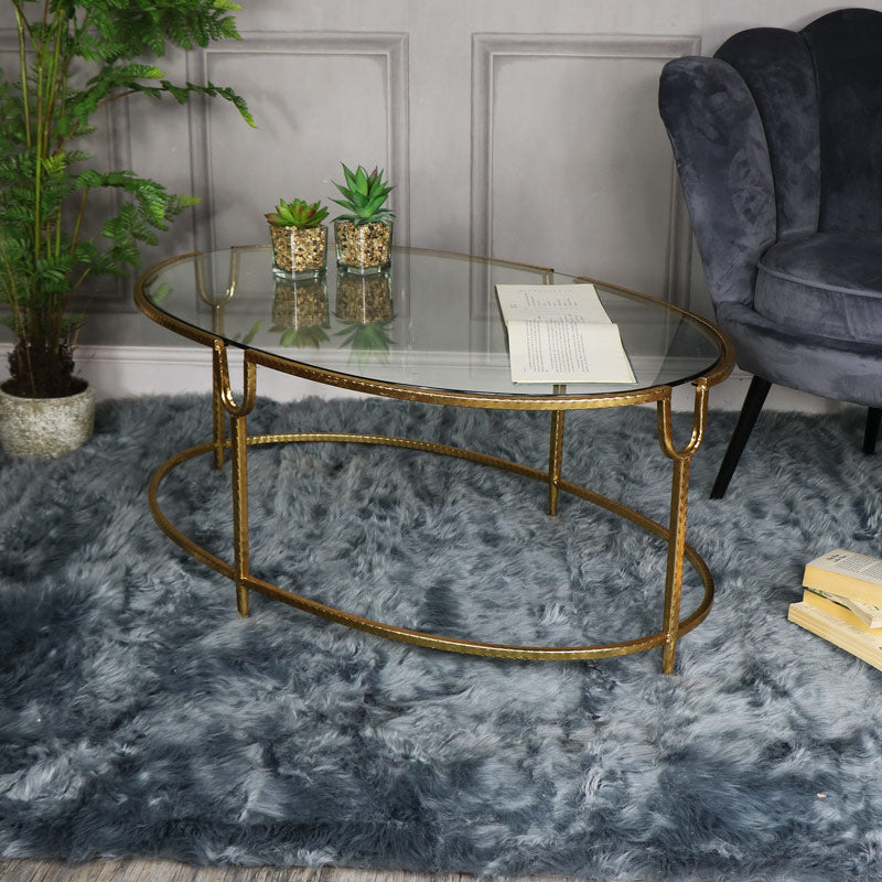 Large Gold Oval Glass Topped Coffee Table