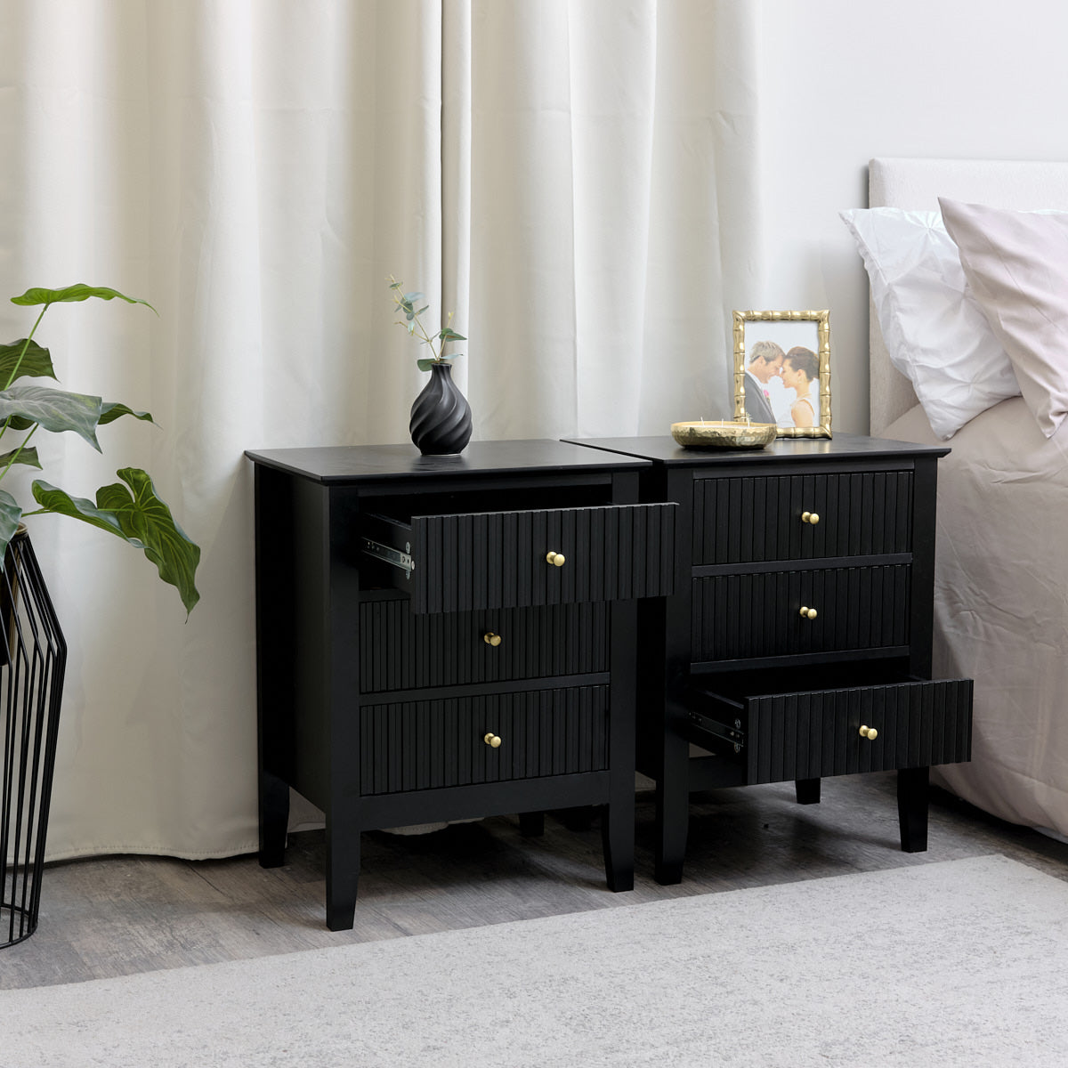 Black three store drawer nightstand